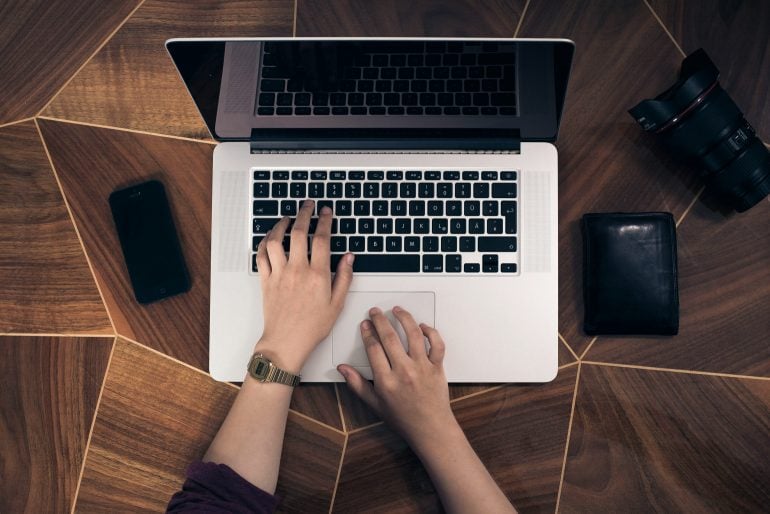 woman using a mac laptop